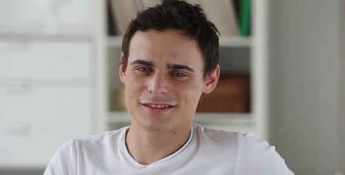 Attractive Young Adult Using Tablet at Home