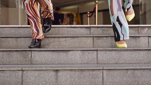 Stylish Young Adults Descend Steps Fashionably