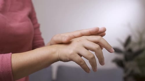 Woman Thoroughly Applies Hand Sanitizer