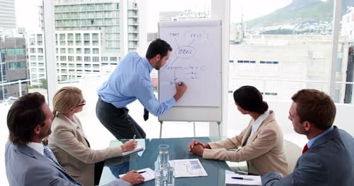Business Team Collaboration During Presentation in Modern Office