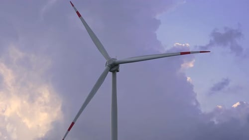 Wind Turbine Generating Power at Sunset