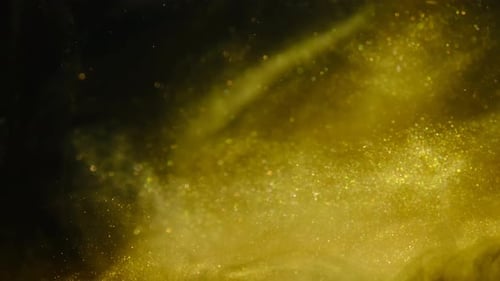 Golden Sand or Dust Creating Abstract Cloud Formations. Art Backgrounds