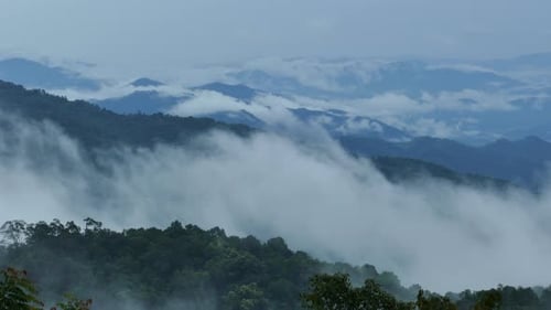 Misty Mountains Landscape View With Swirling Clouds
