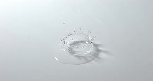 Drop of Water falling into Water, Slow motion 4K