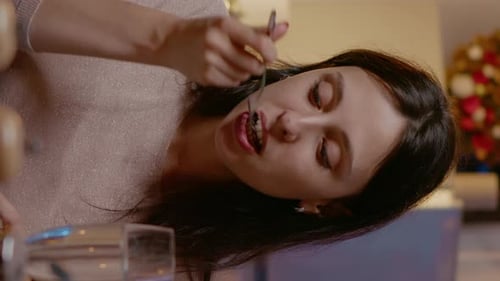 Vertical Video Close Up of Woman Eating Food and Clinking Glass of Champagne