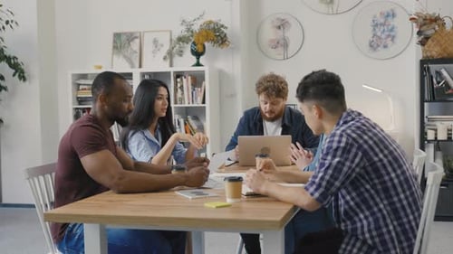 Diverse Team Meeting in Bright Office