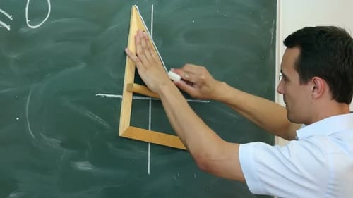 Young Teacher or Student Draw Line Chart on a Blackboard with Formula