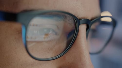 Closeup Portrait of Businessman in Dark Office Working Wearing Glasses