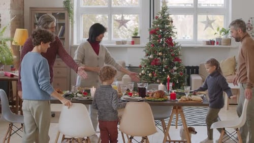 Family Enjoys Festive Holiday Meal Together at Home