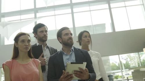 Team of business colleages in lobby, portrait