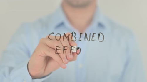 Combined Effort, Man Writing on Transparent Screen