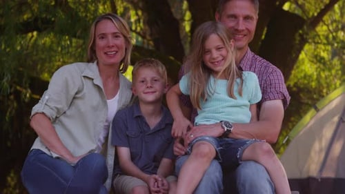 Happy Family Camping in the Woods