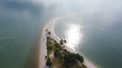 Sandy beach jutting out into the middle of the sea with beautiful water.