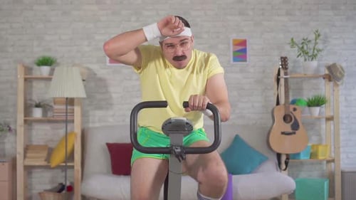 Man Working Out on Exercise Bike