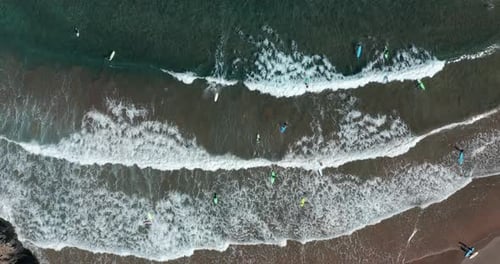 Aerial View. Surfers on Blue Ocean Wave. Surfing Ocean Lifestyle. Extreme Sports.