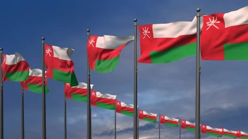 Multiple Realistic Waving Oman Flags Against Blue Sky