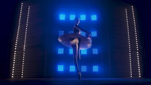 Elegant Ballerina Dancing Gracefully on Stage