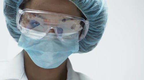 Scientist Works in Lab Wearing Safety Gear