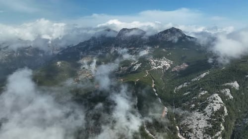 Cloudy landscape high in the mountains aerial view 4 K