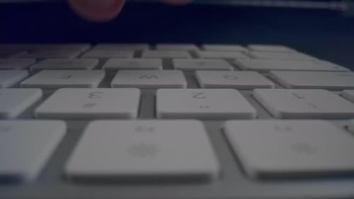 Typing on White Keyboard Close Up Shot