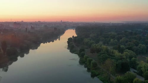 Beautiful morning, summer flight over the river, The bridge over the river in the fog, at dawn