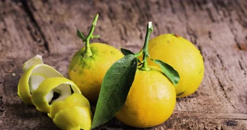 Fresh Lemons Still Life on Rustic Wood