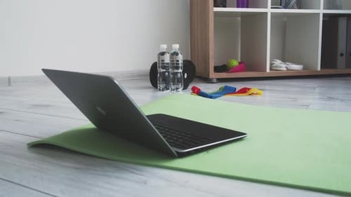 Home Workout Gear with Laptop on Yoga Mat