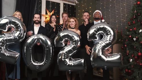 Friends Celebrating New Year's Eve With Balloons