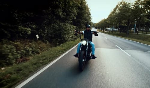 Motorcycle Rides Down Country Road