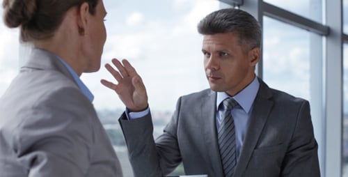 Business People Talking in Modern Office Setting