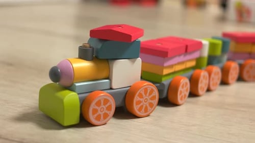 Colorful Toy Train Blocks on Wooden Surface