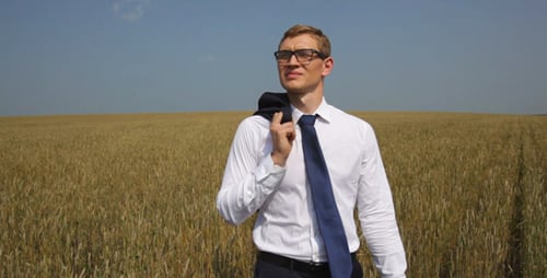 Young Adult in Wheat Field with Jacket