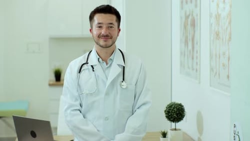 Friendly Doctor Smiling in Bright Office
