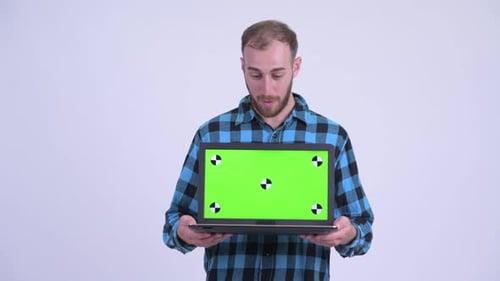 Man Holding Laptop with Chroma Key Screen