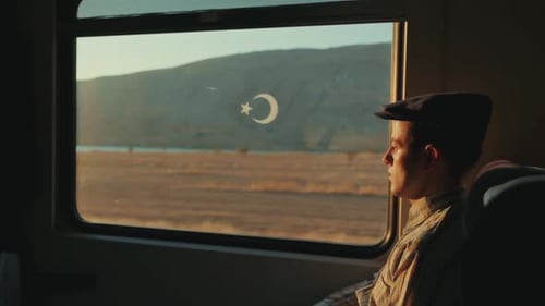 Train Passenger Traveling in Looking Out Window