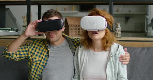 Couple Enjoys Virtual Reality Experience Together at Home