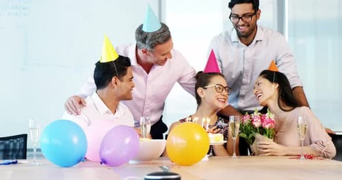 Office Colleagues Celebrate Birthday with Cake and Balloons