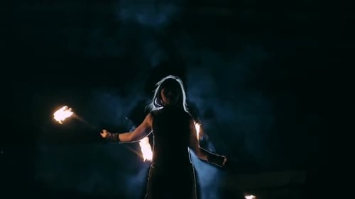 Woman Doing Fire Performance Art at Night