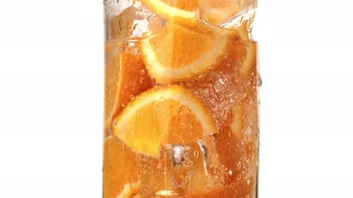 Refreshing Orange Soda with Ice Close Up