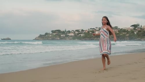 Girl Running Barefoot on Beach Shoreline