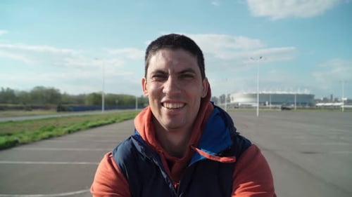 Happy Man Laughing Outside in Parking Lot