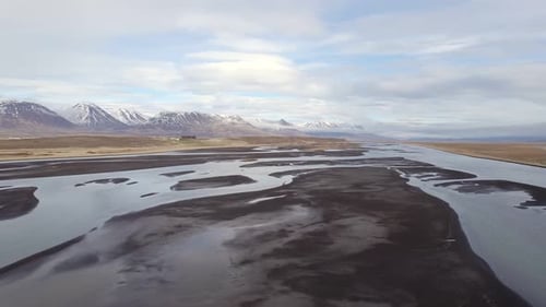 Aerial view over a glacial river system surrounded by a wilderness gorgeous landscape in Iceland