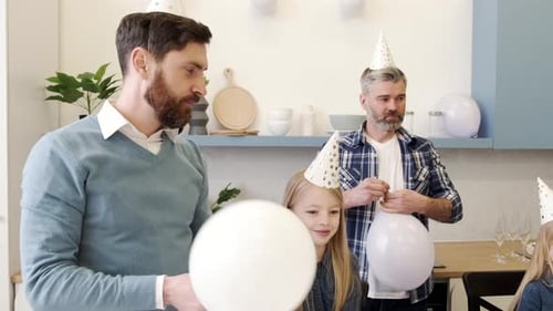 Family Celebrate Birthday with Balloons and Gifts at Home