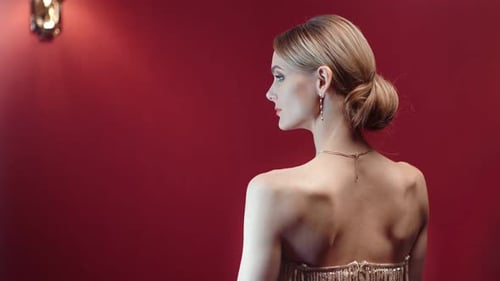 Sexy Girl Naked Shoulders and Evening Hairstyle Posing Back View