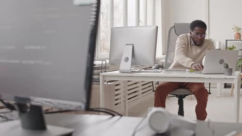 African-American Programmer in Office