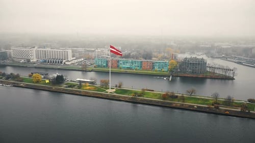 Aerial View of Cityscape with National Flag