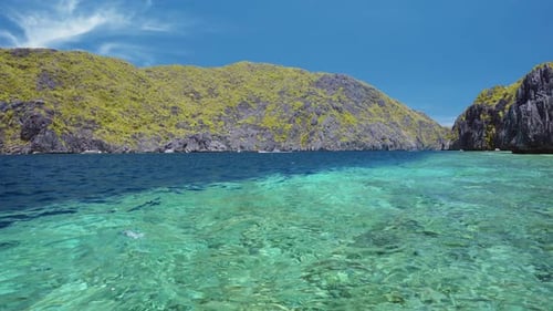 Ocean Strait Rippled Surface on Island Tour. Located on Matinloc Island. Bacuit Archipelago
