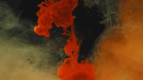 Flowing Red and Beige Ink in Water