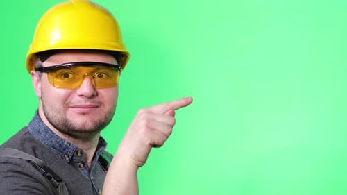 Construction Worker Pointing to Chroma Key Green Screen