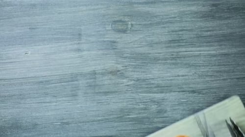 Preparing grilled organic peaches with vanilla ice cream for dessert.